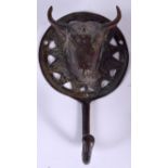 AN EASTERN BRONZE COAT HOOK, in the form of a bull head. 15.5 cm long.