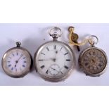 AN ANTIQUE SILVER POCKET WATCH together with two smaller antique fob watches. Largest 4.5 cm diamet
