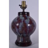 A CHINESE QING DYNASTY FLAMBÉ PORCELAIN VASE, formed with a mottled drip glaze, converted to lamp.