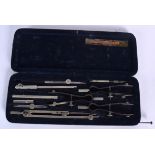 AN ANTIQUE CASED MATHEMATICAL DRAWING SET, bearing inner label “C.H VESSEY, M. INST. B.E.”. 24 cm w