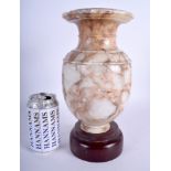 AN 18TH/19TH CENTURY CONTINENTAL CARVED MARBLE VASE Antiquity style, upon a wooden base. 28 cm high