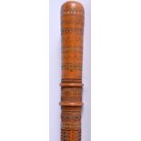 A MID 19TH CENTURY CONTINENTAL CARVED WOOD WALKING CANE decorated with star motifs and swirling vin