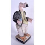 AN UNUSUAL WOODEN SCULPTURE OF A FLAMINGO, modelled wearing a suit. 54 cm high.