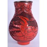 A RARE 1950S CHINESE CULTURAL REVOLUTION CINNABAR LACQUER VASE decorated with foliage and figures.