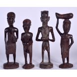 FOUR AFRICAN WOODEN CARVED FIGURES, modelled carrying various vessels. 17.5 cm. (4)
