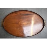 AN EDWARDIAN WOODEN TEA TRAY, with central satinwood inlaid decoration. 57 cm wide.