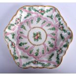 A 18TH CENTURY WORCESTER TEAPOT STAND painted with swags of fruiting vines. 16 cm wide.