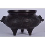 A CHINESE TWIN HANDLED BRONZE CENSER, decorated in relief with the phoenix bird. 21 cm wide.