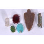 A CARVED ARROW HEAD, together with an agate bead etc. (qty)