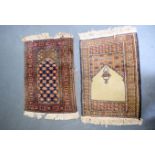 A BEIGE GROUND PRAYER MAT RUG, together with a red ground floral example. 63 cm x 41 cm. (2)