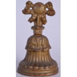 A VICTORIAN CAST IRON DOOR STOP, formed with a floral wreath and splayed base. 22 cm high.