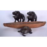 A PAIR OF AFRICAN HARDWOOD LION FIGURES, together with a wooden boat and a tortoise. Boat 41 cm. (4