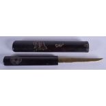 A 19TH CENTURY JAPANESE MEIJI PERIOD BLACK LACQUER CASED KNIFE decorated with fish and coinage. 24