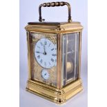 A FRENCH BRASS CARRIAGE CLOCK with engraved brass dial. 17.5 cm high inc handle.
