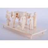 A 19TH CENTURY INDIAN CARVED IVORY PROCESSIONAL GROUP modelled figures carrying a female. 19 cm x 9