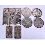 A GROUP OF NINE CHINESE WHITE METAL PLAQUES, depicting varying subject. Largest 15.5 cm long. (9)