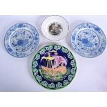 AN ART DECO MAILING POTTERY PLATE together with a creamware plate and two others. Largest 27 cm dia