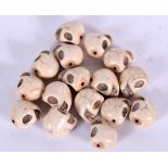 A QUANTITY OF CARVED STONE SKULL BEADS. (qty)