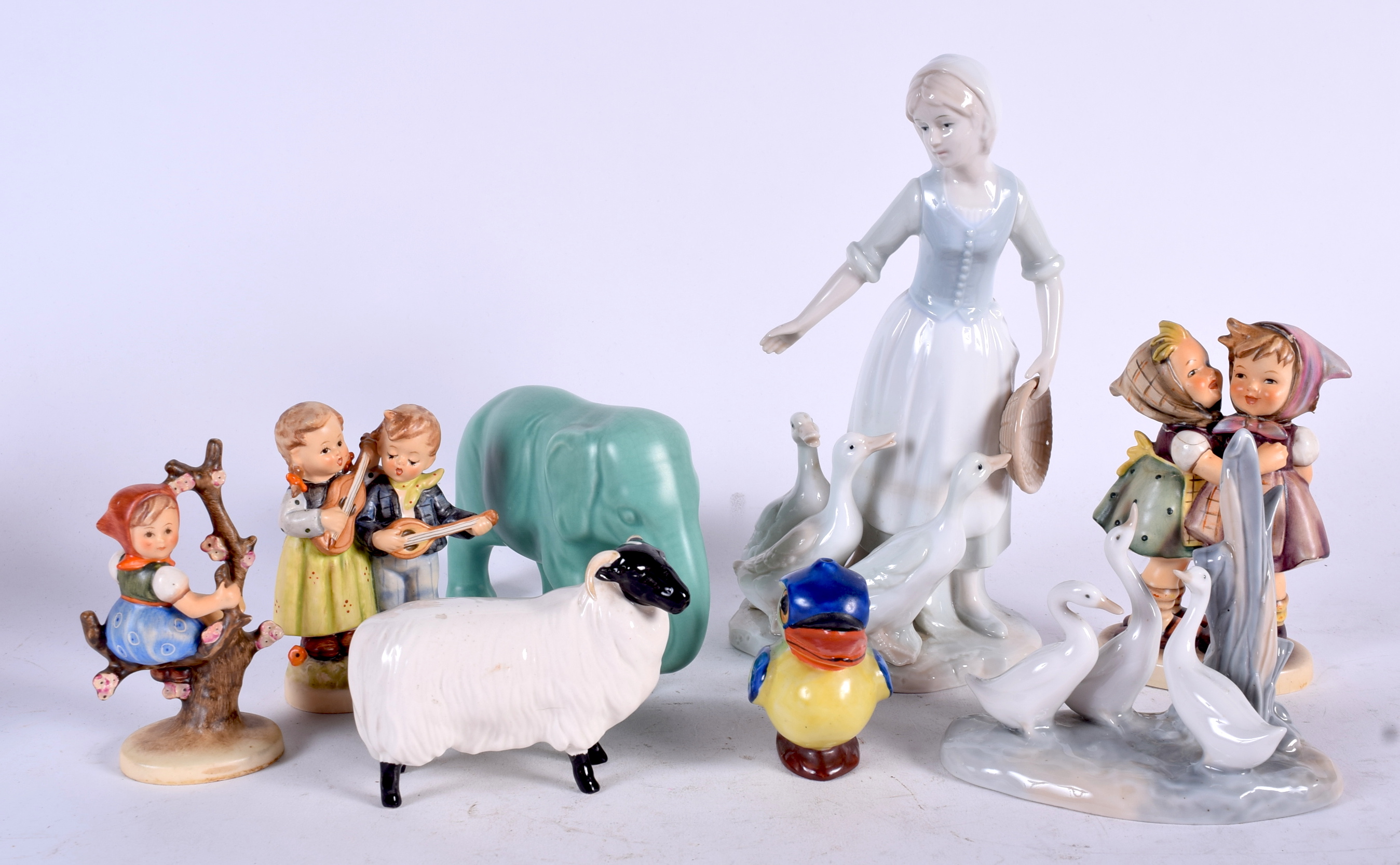 THREE GOEBBELS PORCELAIN FIGURINES, together with a Nao group, Beswick sheep etc. (8)