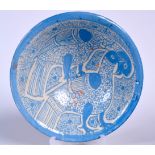 A PERSIAN POTTERY BOWL, decorated with birds in an embrace. 21.5 cm wide.