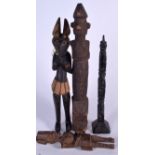 FOUR WOODEN TRIBAL STATUES, varying form. Largest 42 cm. (4)