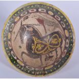 A PERSIAN POTTERY BOWL, decorated with a horse. 21.5 cm wide.