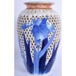 A RARE 19TH CENTURY JAPANESE BLUE AND WHITE RETICULATED VASE painted with flowers. 19 cm high.