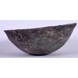 AN EARLY ISLAMIC METAL BOWL, of plain form. 16 cm wide.