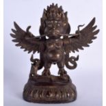 A TIBETAN BRONZE FIGURE OF A WINGED BEAST 20th Century. 23 cm x 16 cm.