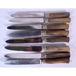 A SET OF EIGHT HORN HANDLED KNIVES, possibly rhinoceros. 24.5 cm long. (8)