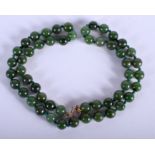 A 9CT GOLD CHINESE SPINACH JADEITE NECKLACE. 48 cm long.