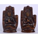 A PAIR OF CHINESE SINO TIBETAN BRONZE BUDDHA, seated upon a throne in the form of an open hand.9.5