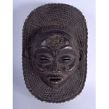 AN EARLY 20TH CENTURY AFRICAN CARVED WOOD TRIBAL MASK decorated with motifs. 18 cm x 26 cm.