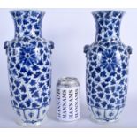 A LARGE PAIR OF 19TH CENTURY CHINESE BLUE AND WHITE VASES Qing, painted with flowers. 30 cm high.