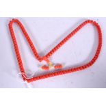 A CORAL TYPE NECKLACE, formed with flattened beads. 82 cm long.