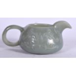 AN EARLY 20TH CENTURY CHINESE ISLAMIC MARKET GREEN JADE JUG, formed with a beak shaped spout and ca