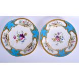 A NEAR PAIR OF 19TH CENTURY SEVRES STYLE COALPORT PLATES painted with birds and foliage in the mann