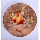 A ROYAL WORCESTER PLATE painted with fruit by Paul Love, signed, date code 1955. 27 cm wide.