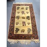 A BEIGE GROUND TURKISH RUG, decorated with foliage. 150 cm x 78 cm.