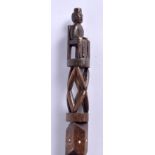 AN UNUSUAL EARLY 20TH CENTURY CARVED FOLK ART WALKING CANE inlaid with bone overlaid with vines. 10