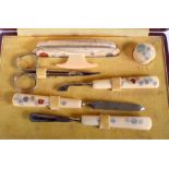 AN EARLY 20TH CENTURY JAPANESE MEIJI PERIOD CARVED IVORY MANICURE KIT decorated with shibayama inla