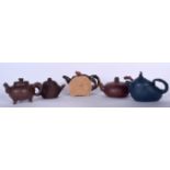 A GROUP OF FIVE CHINESE YIXING OR ZISHA POTTERY TEA POTS, varying design. (5)