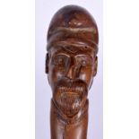 A 19TH CENTURY BAVARIAN BLACK FOREST CARVED WOOD WALKING STICK with portrait terminal. 85 cm long.