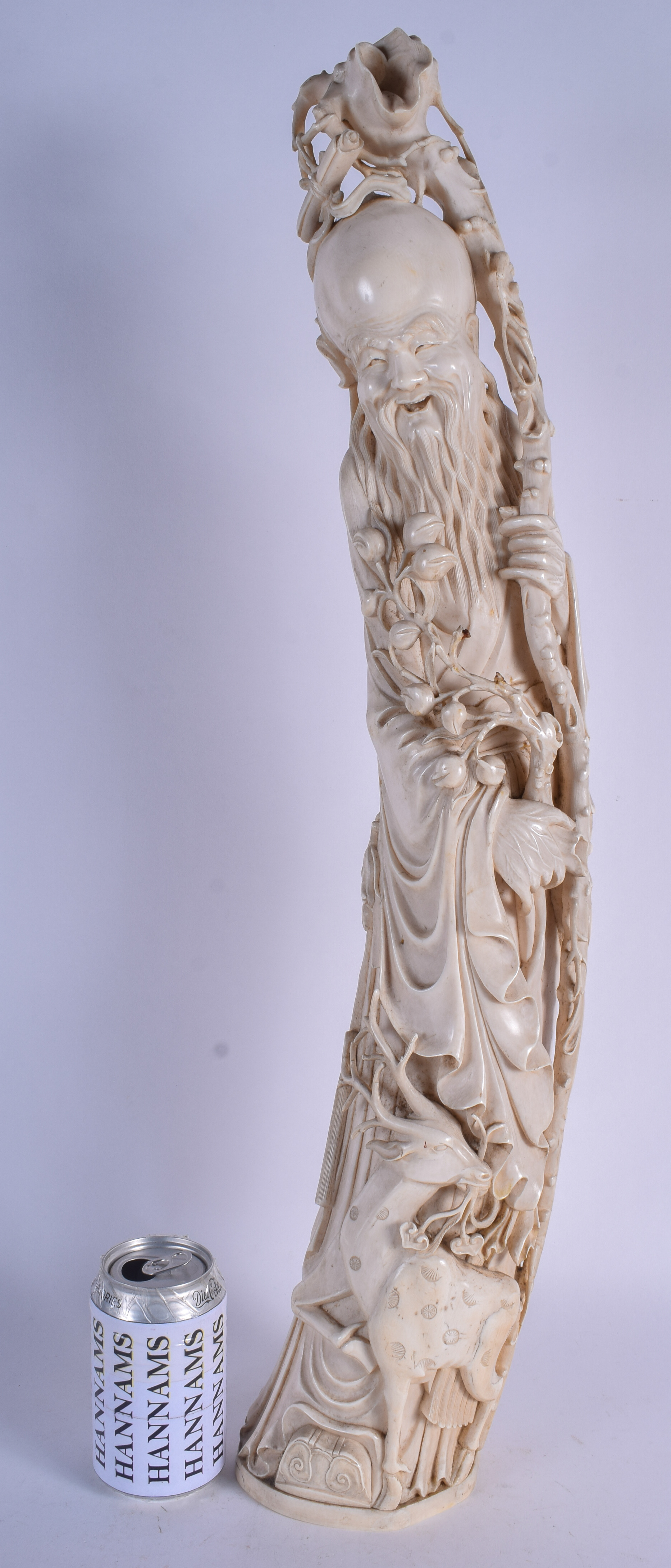 A VERY LARGE 19TH CENTURY CHINESE CARVED IVORY FIGURE OF SAGE Late Qing, modelled standing beside a
