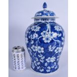 A LARGE 19TH CENTURY CHINESE BLUE AND WHITE VASE AND COVER painted with foliage. 34 cm high.
