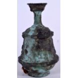 AN EARLY BRONZE VASE, formed with a ribbed body and flared neck. 16 cm high.
