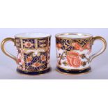 A PAIR OF ROYAL CROWN DERBY MINIATURE IMARI MUGS. 3.75 cm high.