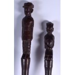 A PAIR OF EARLY 20TH CENTURY AFRICAN TRIBAL COLONIAL HARDWOOD SWAGGER STICKS with figural terminals