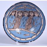 A PERSIAN POTTERY BOWL, decorated with five females gazing over swimming fish. 22.5 cm wide.