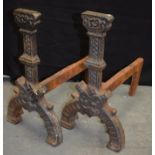 A PAIR OF 19TH CENTURY CAST IRON FIRE DOGS Tudor Revival, dated 1595. Note: An Identical pair resid